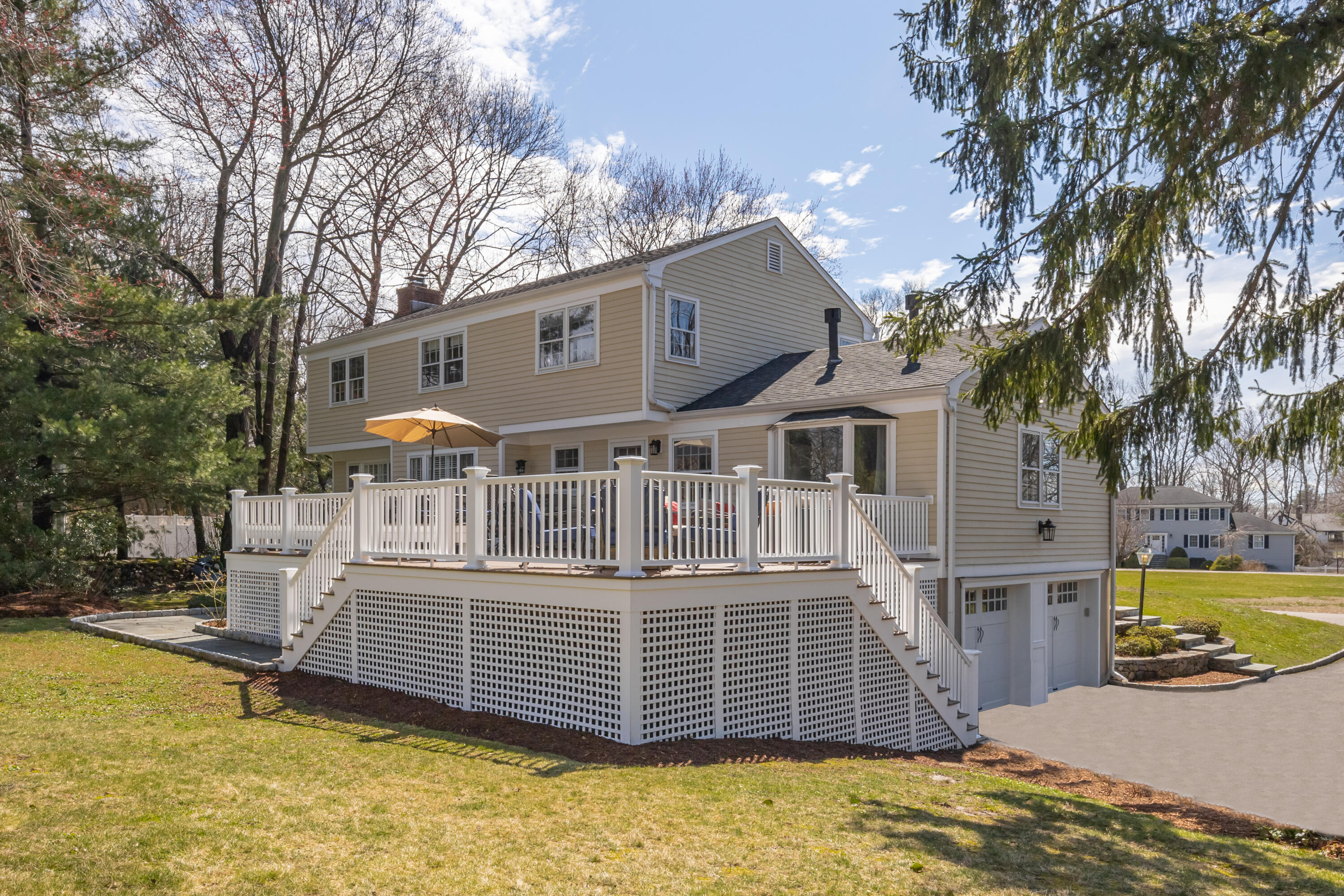 9 Duffy's Lane Darien, CT 06820 - Photo 3 of 42 a front view of a house with a yard