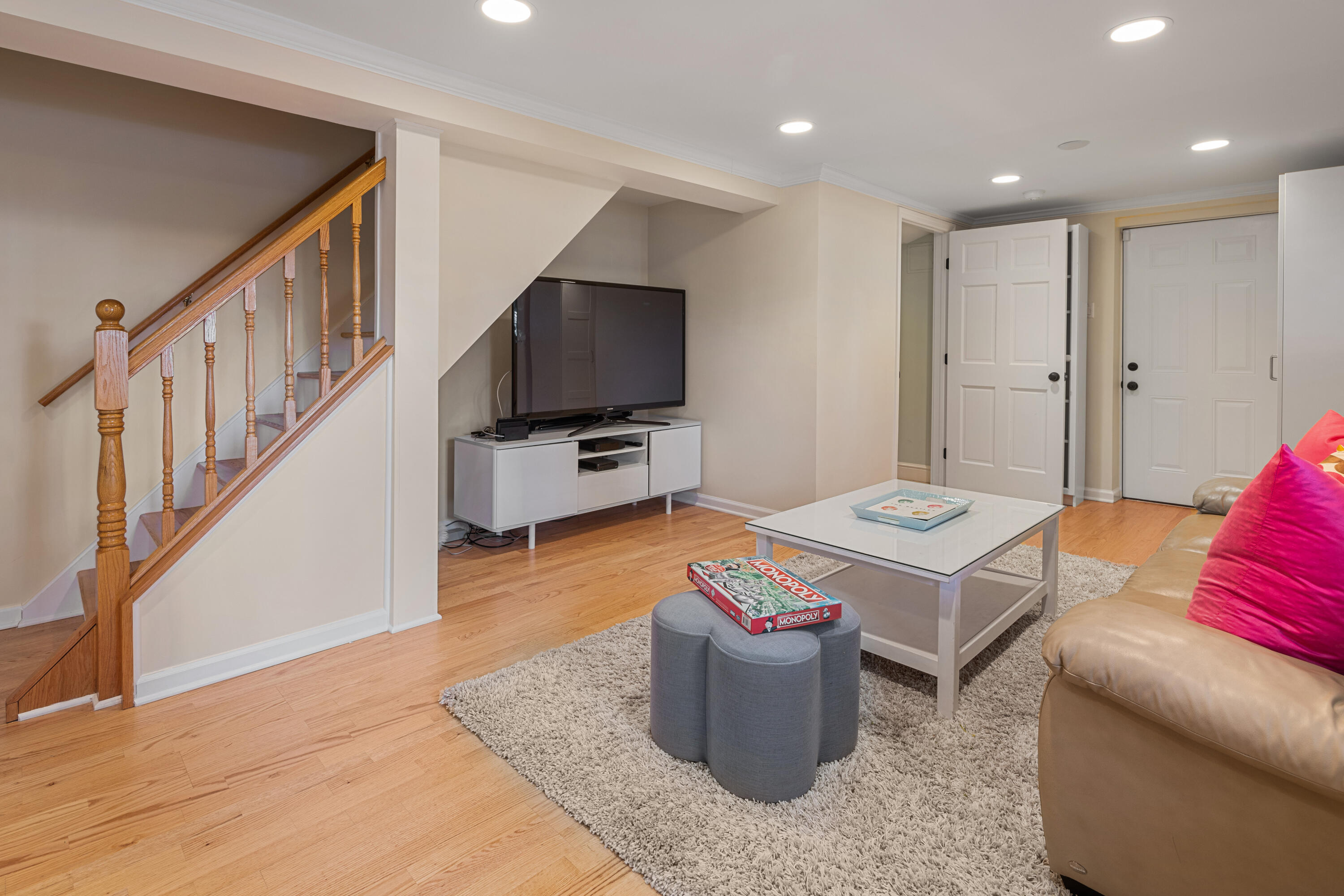 9 Duffy's Lane Darien, CT 06820 - Photo 31 of 42 a living room with furniture a flat screen tv and kitchen view