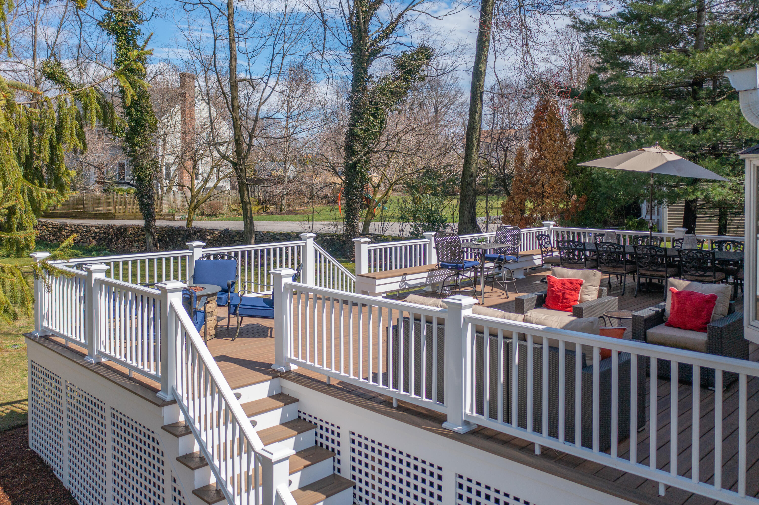 9 Duffy's Lane Darien, CT 06820 - Photo 34 of 42 a view of a roof deck with couches and wooden fence