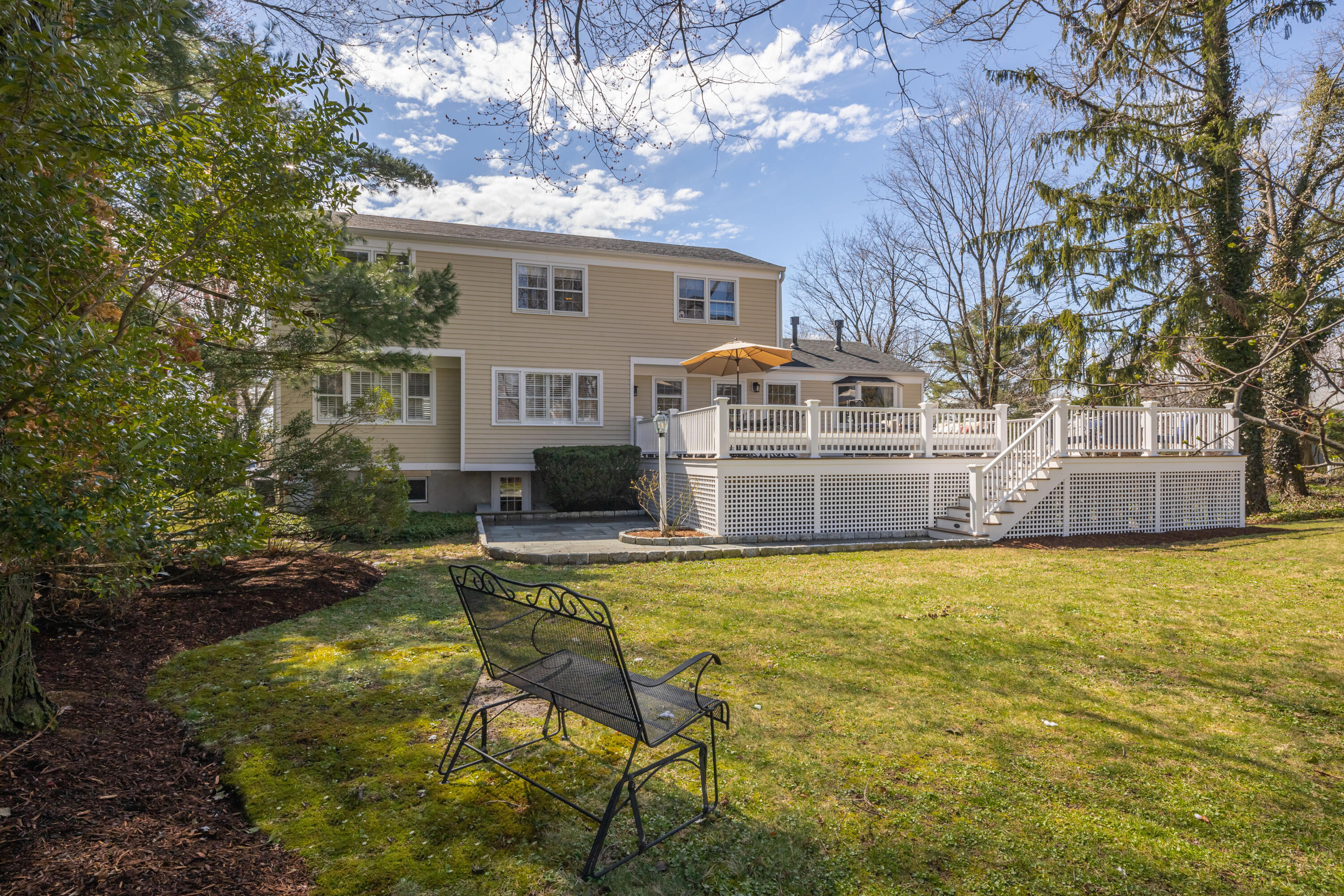 9 Duffy's Lane Darien, CT 06820 - Photo 37 of 42 a view of house with yard outdoor seating and covered with trees