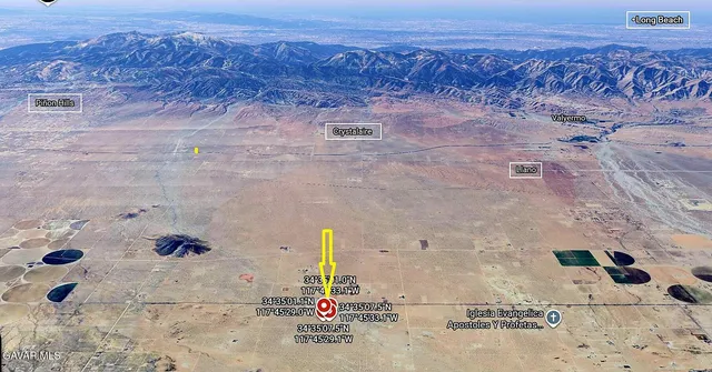 a view of an ocean beach and mountain