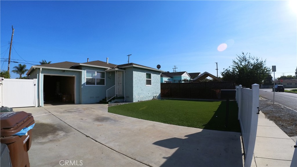 1808 North Grape Avenue Compton, CA 90222 - Photo 13 of 35 a view of a house with a backyard
