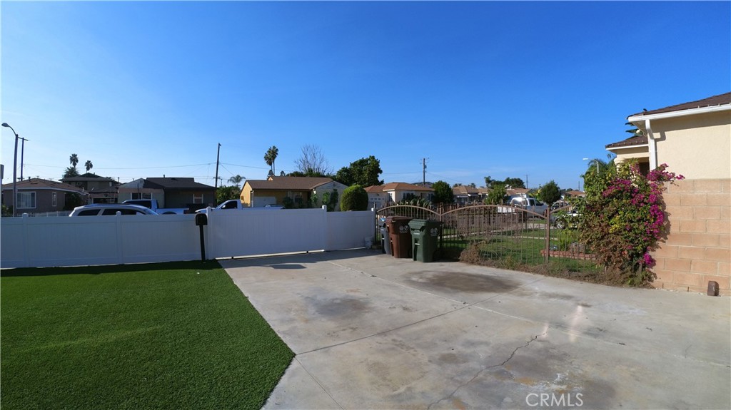 1808 North Grape Avenue Compton, CA 90222 - Photo 16 of 35 a view of a house with a yard