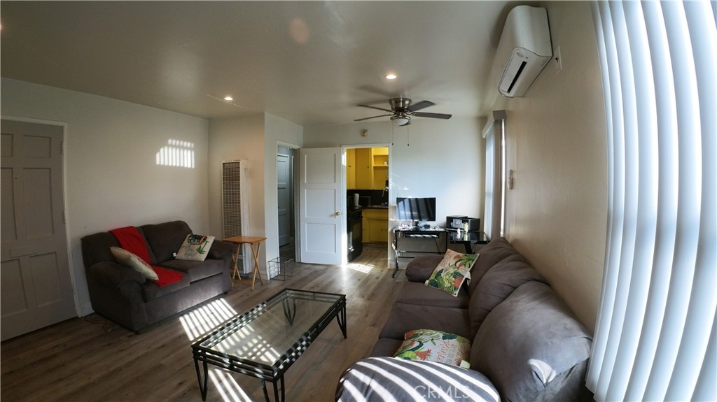 1808 North Grape Avenue Compton, CA 90222 - Photo 17 of 35 a living room with furniture and a chandelier