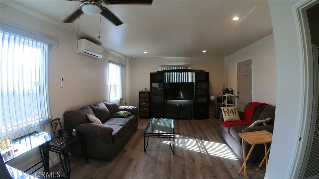1808 North Grape Avenue Compton, CA 90222 - Photo 18 of 35 a living room with furniture and a flat screen tv