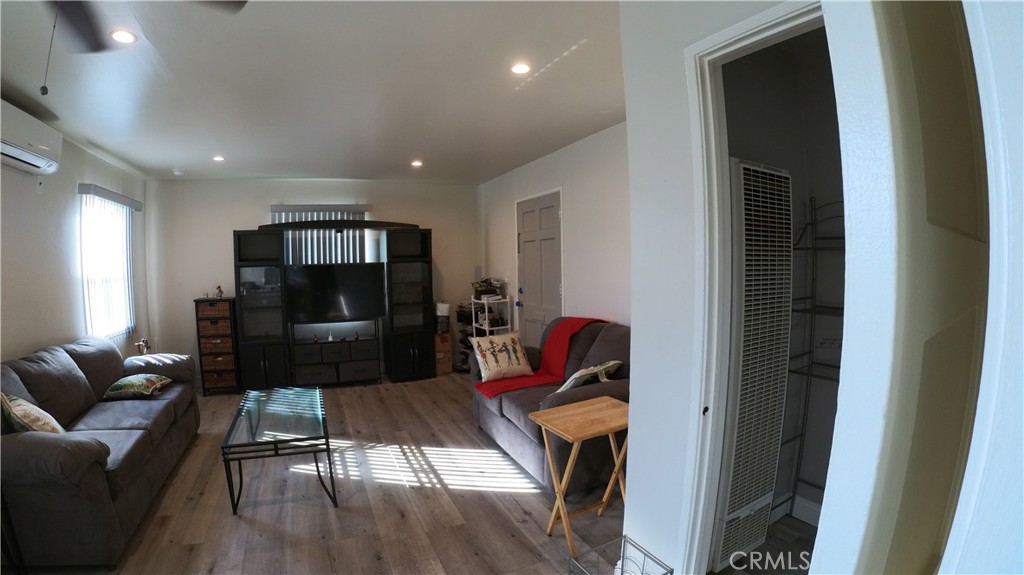 1808 North Grape Avenue Compton, CA 90222 - Photo 20 of 35 a living room with furniture and a flat screen tv
