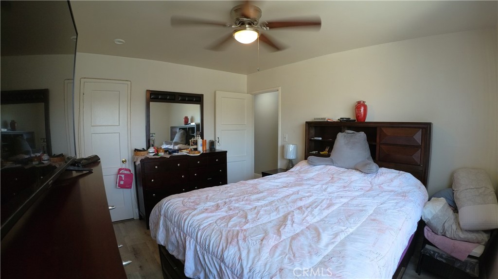 1808 North Grape Avenue Compton, CA 90222 - Photo 23 of 35 a bedroom with a bed and a closet