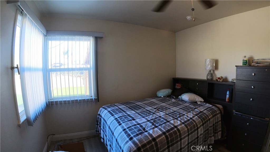 1808 North Grape Avenue Compton, CA 90222 - Photo 25 of 35 a bedroom with a bed and a window
