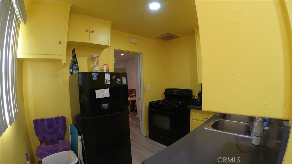 1808 North Grape Avenue Compton, CA 90222 - Photo 28 of 35 a living room with a couch and a table