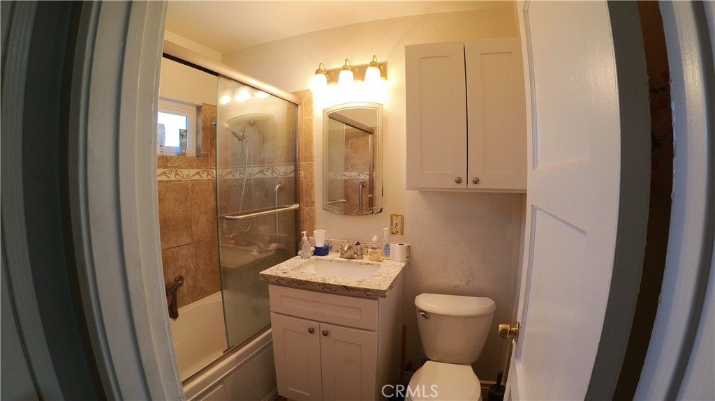1808 North Grape Avenue Compton, CA 90222 - Photo 29 of 35 a bathroom with a granite countertop sink toilet and shower