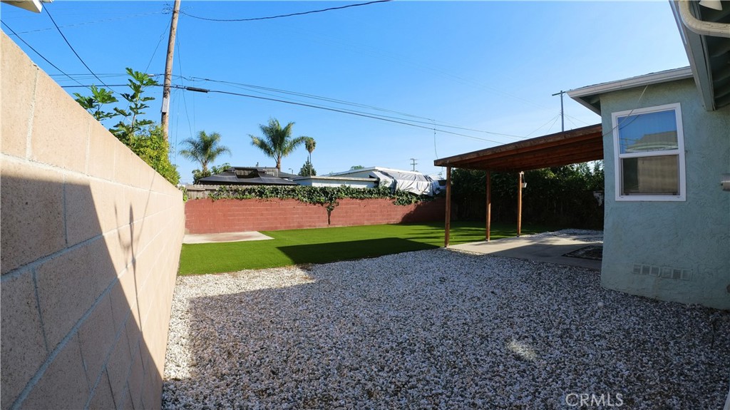 1808 North Grape Avenue Compton, CA 90222 - Photo 10 of 35 a view of a house with a yard and a porch