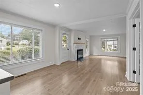 a view of empty room with a fireplace