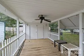 a view of yard with swimming pool and trees