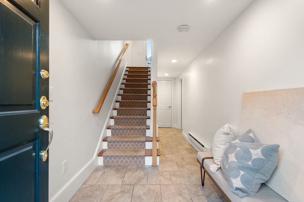 10 Bartlett Street Boston, MA 02129 - Photo 24 of 34 a view of entryway and hall with wooden floor