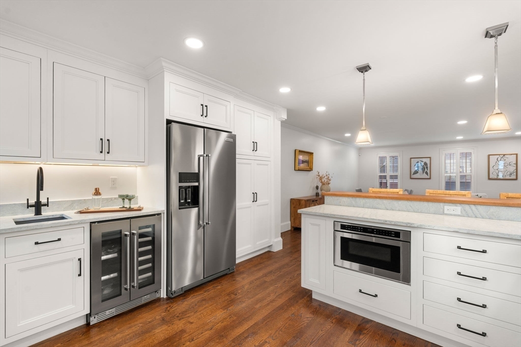 10 Bartlett Street Boston, MA 02129 - Photo 3 of 34 a kitchen with stainless steel appliances granite countertop a stove and a refrigerator