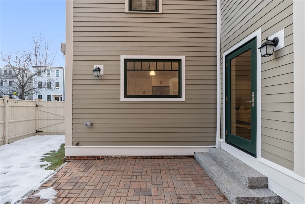 10 Bartlett Street Boston, MA 02129 - Photo 34 of 34 a view of a house with a door and wooden floor