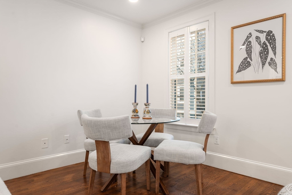 10 Bartlett Street Boston, MA 02129 - Photo 9 of 34 a view of a dining room with furniture and wooden floor