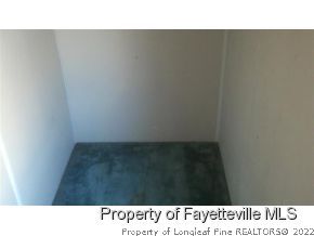 6237 Sandy Creek Road Stedman, NC 28391 - Photo 11 of 17 a open area with wooden floor