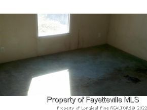6237 Sandy Creek Road Stedman, NC 28391 - Photo 12 of 17 a open hall with a window