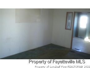 6237 Sandy Creek Road Stedman, NC 28391 - Photo 3 of 17 a black and white photo of a room