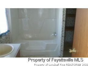 6237 Sandy Creek Road Stedman, NC 28391 - Photo 9 of 17 a bathroom with a sink and a shower