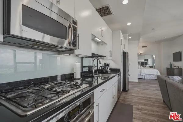 a kitchen with a stove and a microwave