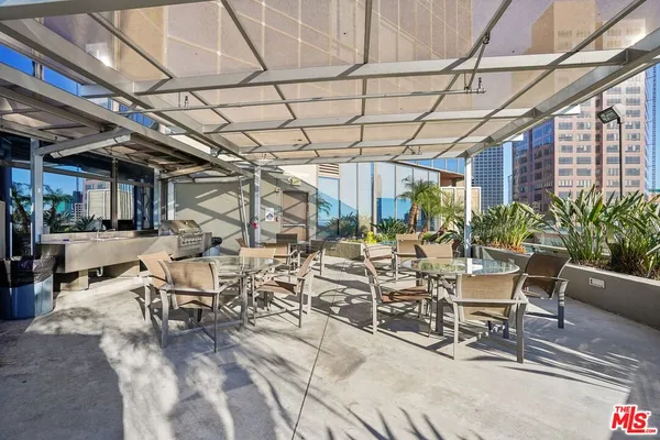 a view of a chairs and table in wooden roof