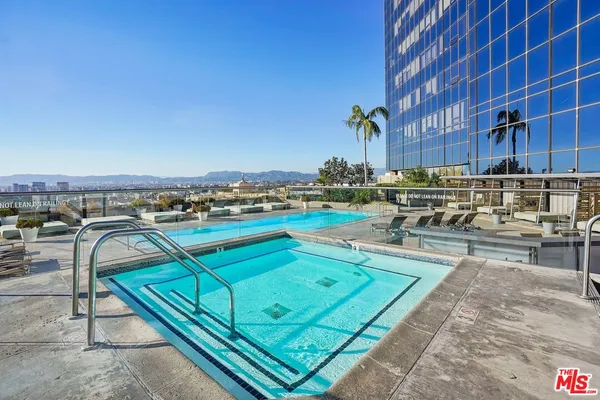 a view of a swimming pool with a patio