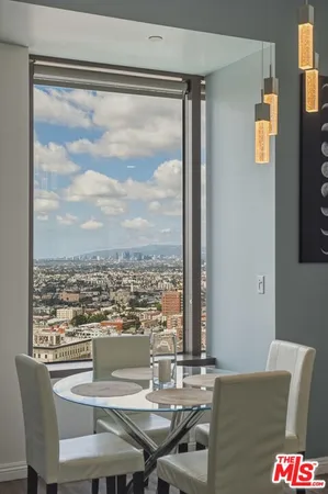 a view of a dining room with furniture window and outside view