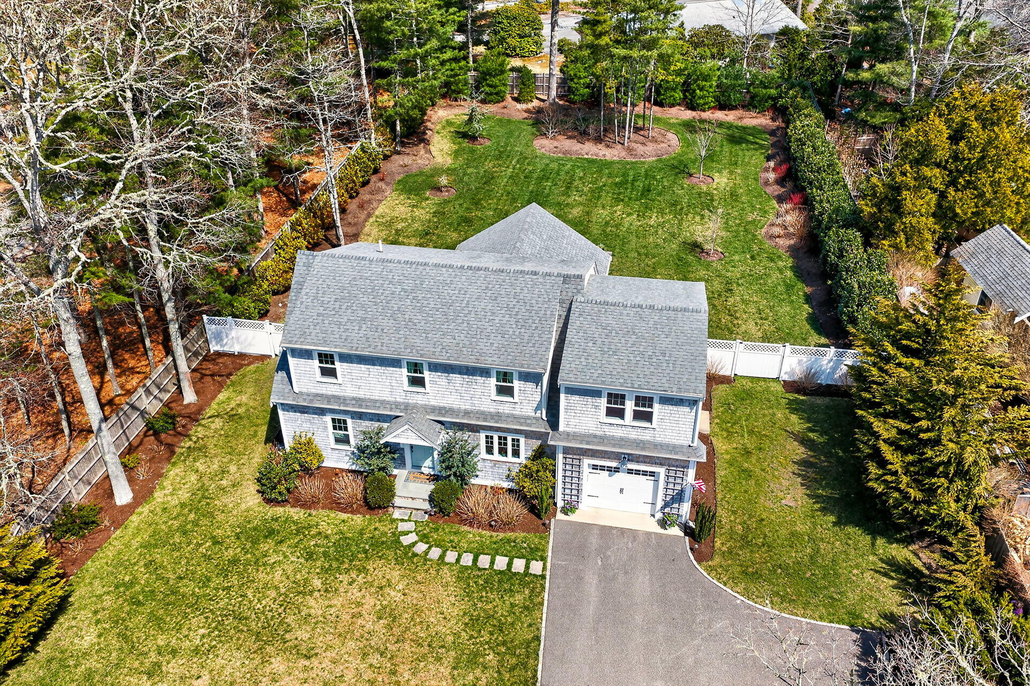 176 Bumps River Road Osterville, MA 02655 - Photo 41 of 54 an aerial view of a house with a garden and plants