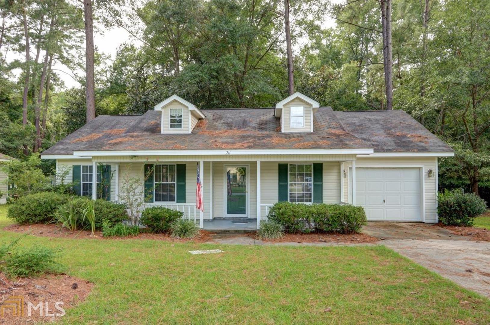 211 Woodbury Lane Rincon, GA 31326 - Photo 1 of 1 a front view of house with yard and green space
