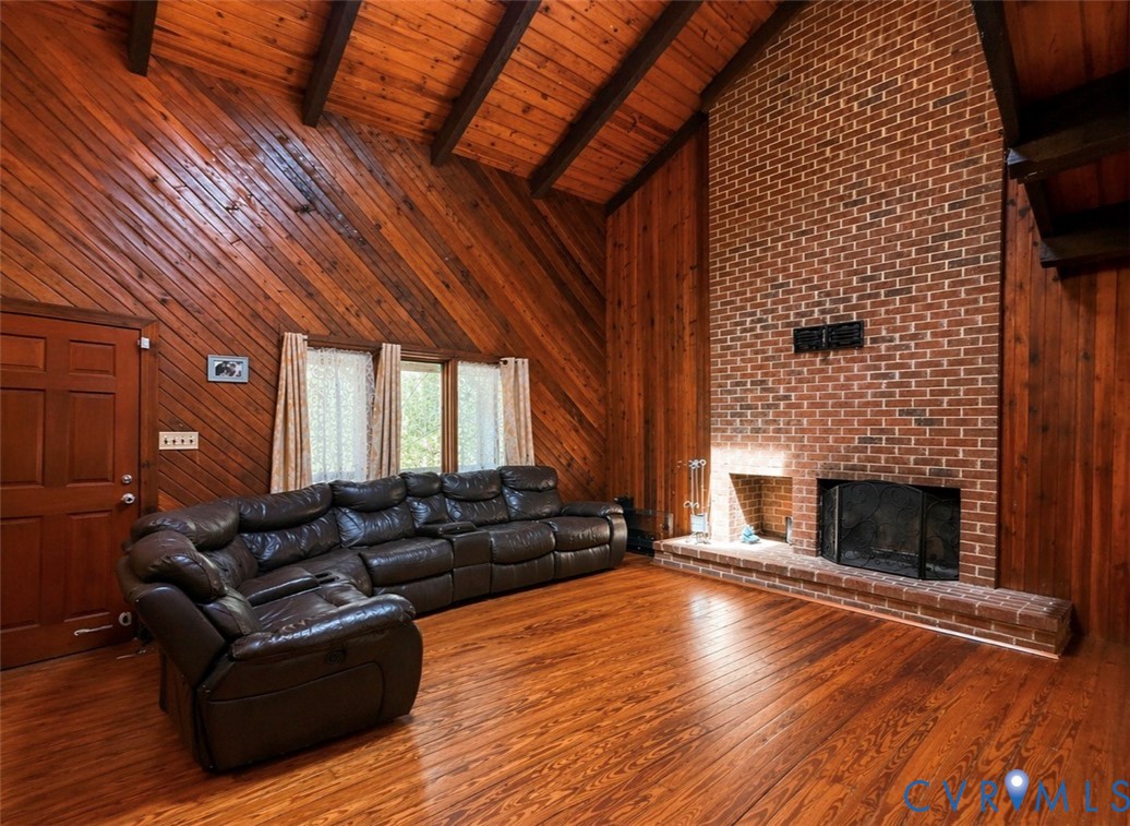 18318 Wards Creek Road Disputanta, VA 23842 - Photo 2 of 16 a living room with furniture and a fireplace