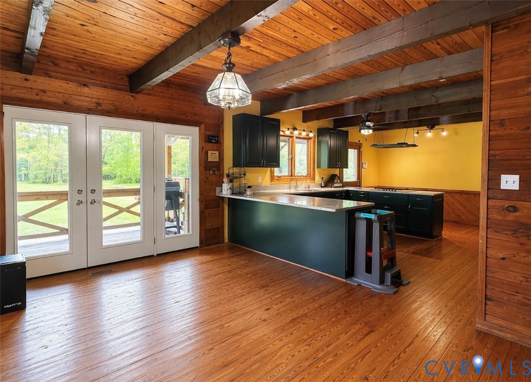 18318 Wards Creek Road Disputanta, VA 23842 - Photo 3 of 16 an empty room with wooden floor and windows