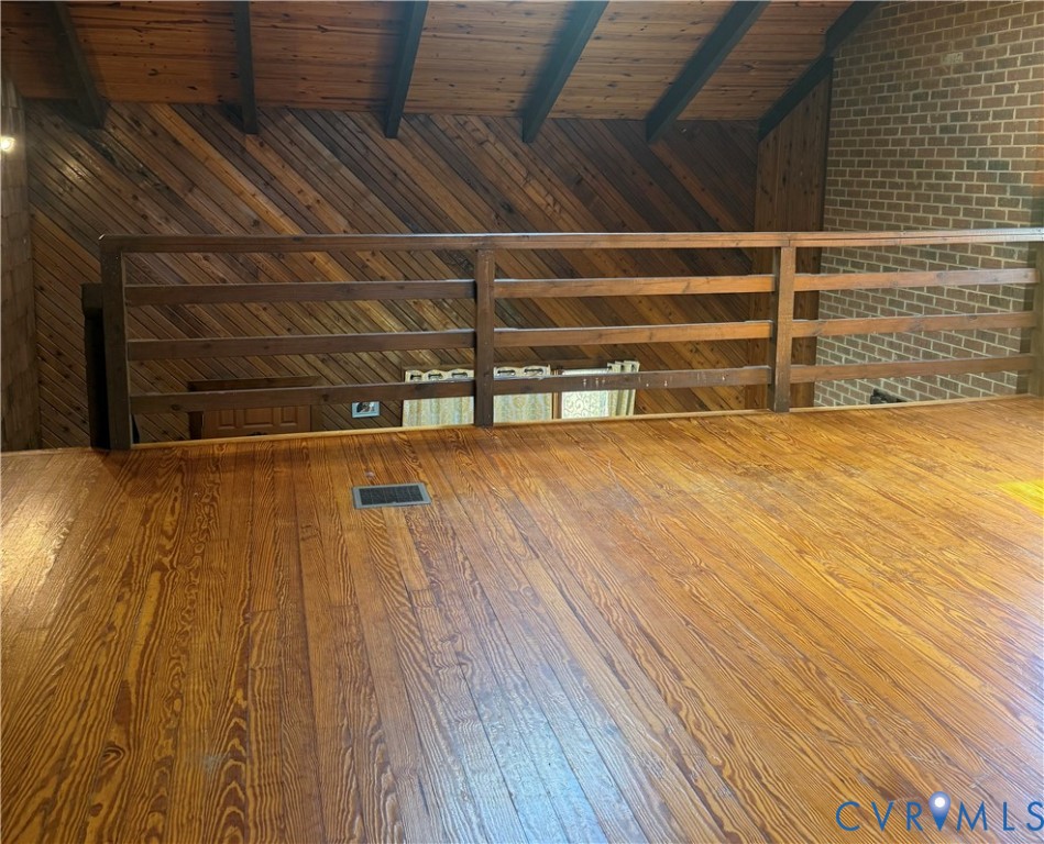 18318 Wards Creek Road Disputanta, VA 23842 - Photo 9 of 16 a view of an empty room with wooden floor