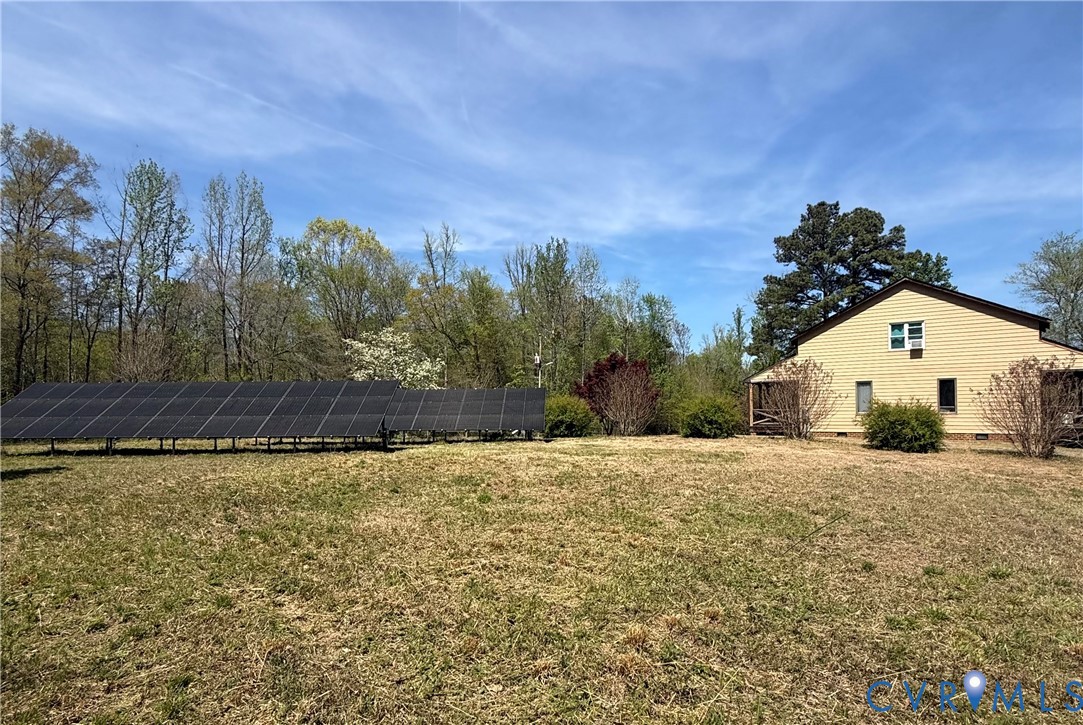 18318 Wards Creek Road Disputanta, VA 23842 - Photo 10 of 16 a view of a large garden with large trees