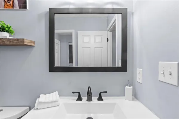 a bathroom with a sink and a toilet