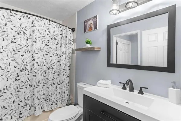 a bathroom with a sink and a toilet