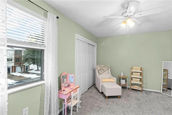 a bedroom with furniture and a window