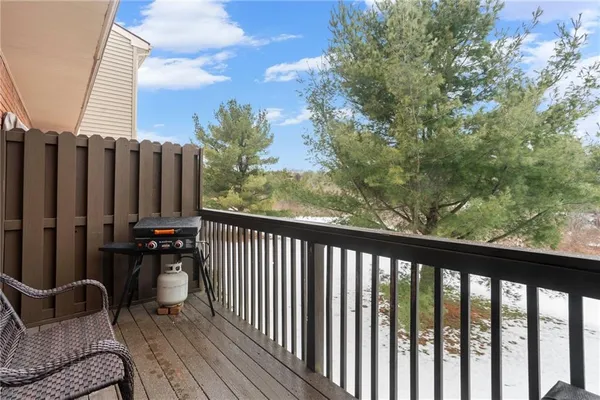 a balcony with chairs