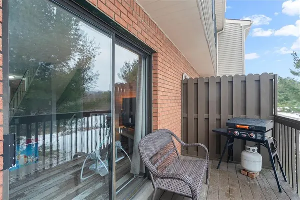 a view of a chairs on the roof deck