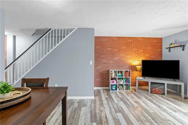 a view of a livingroom with furniture and wooden floor