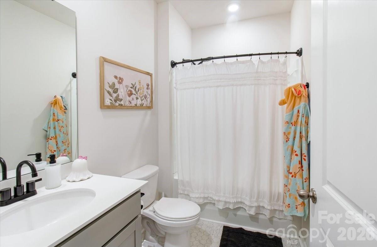 345 Ridgeview Lane Mars Hill, NC 28754 - Photo 11 of 13 a bathroom with a sink toilet and shower
