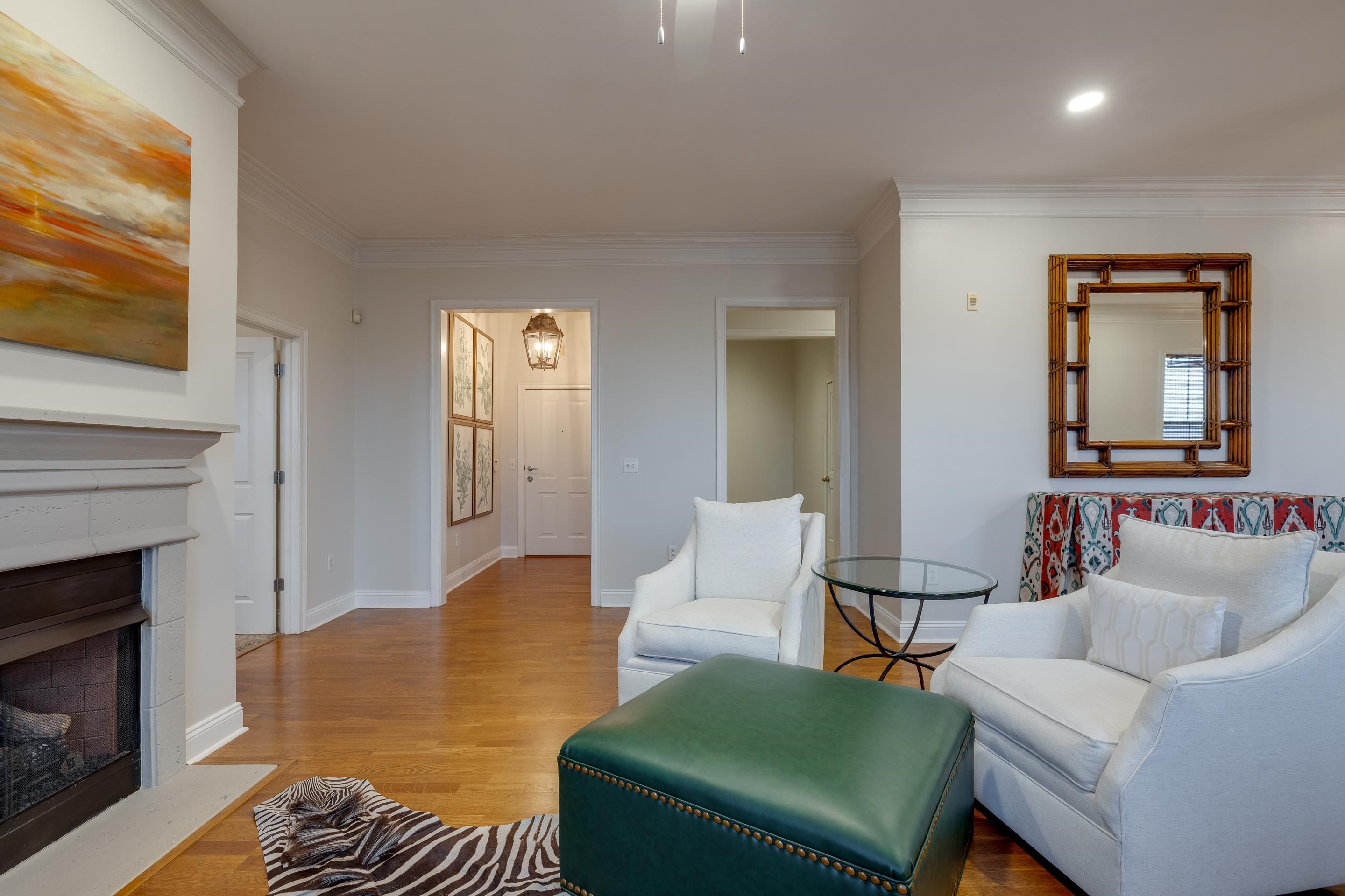 680 Harbor Bend Road, Unit 212 Memphis, TN 38103 - Photo 3 of 23 Living room featuring light hardwood / wood-style floors and ornamental molding