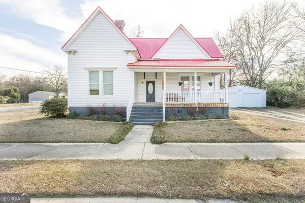 a front view of a house with porch