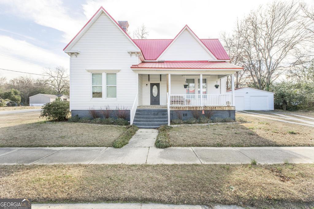 a front view of a house with porch