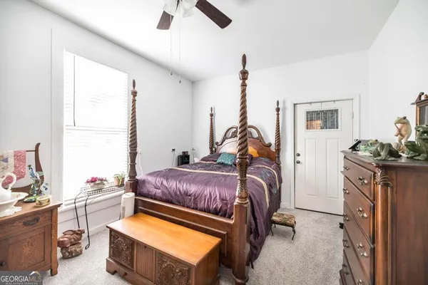 a bed room with a bed and a window