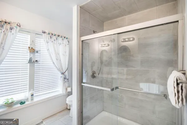 a bathroom with a shower and a bathtub