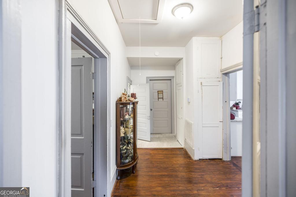 169 West Dykes Street Cochran, GA 31014 - Photo 18 of 34 a view of a hallway with wooden floor and closet