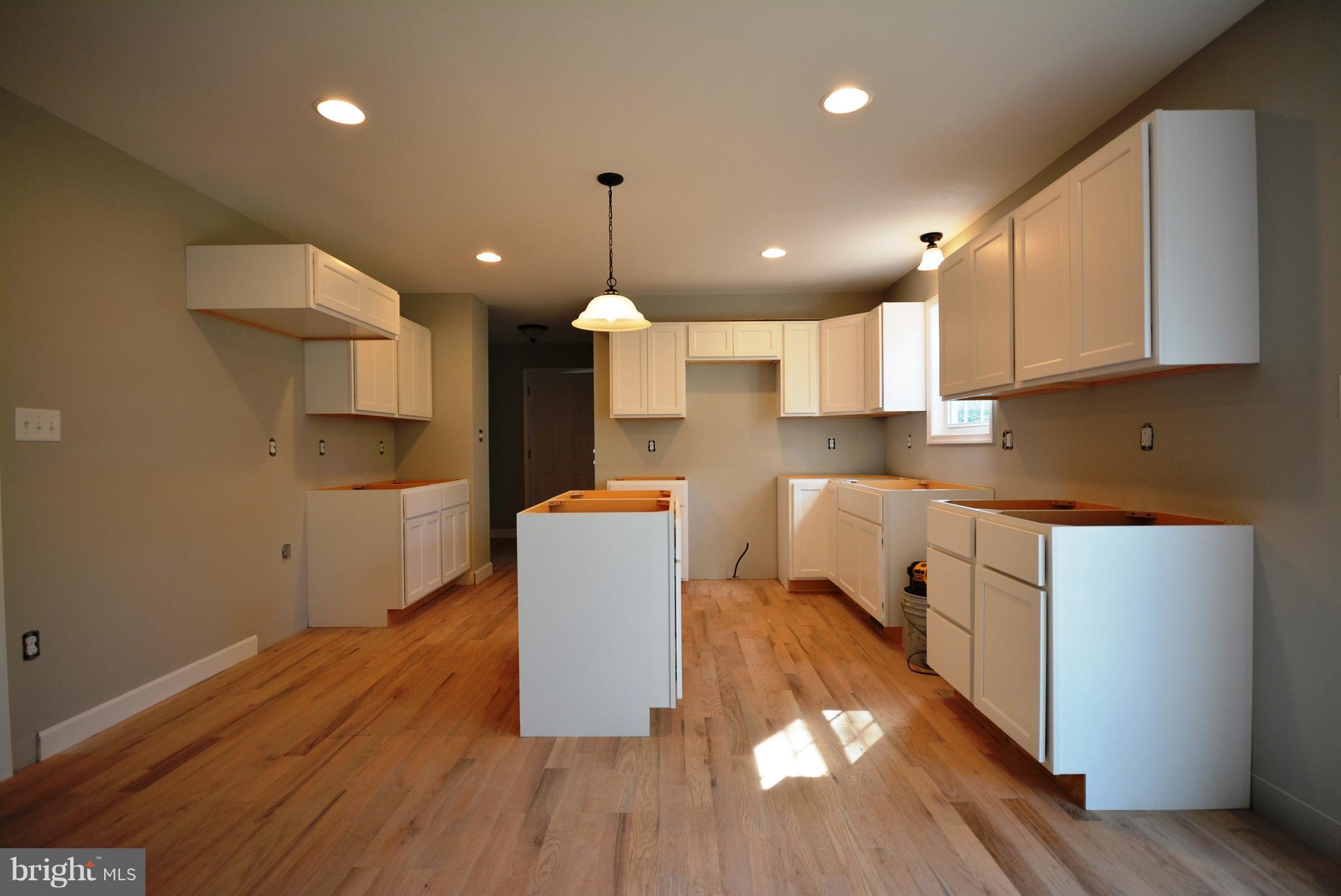 155 Lower View Road Strasburg, VA 22657 - Photo 13 of 30 a kitchen with stainless steel appliances a refrigerator sink and microwave