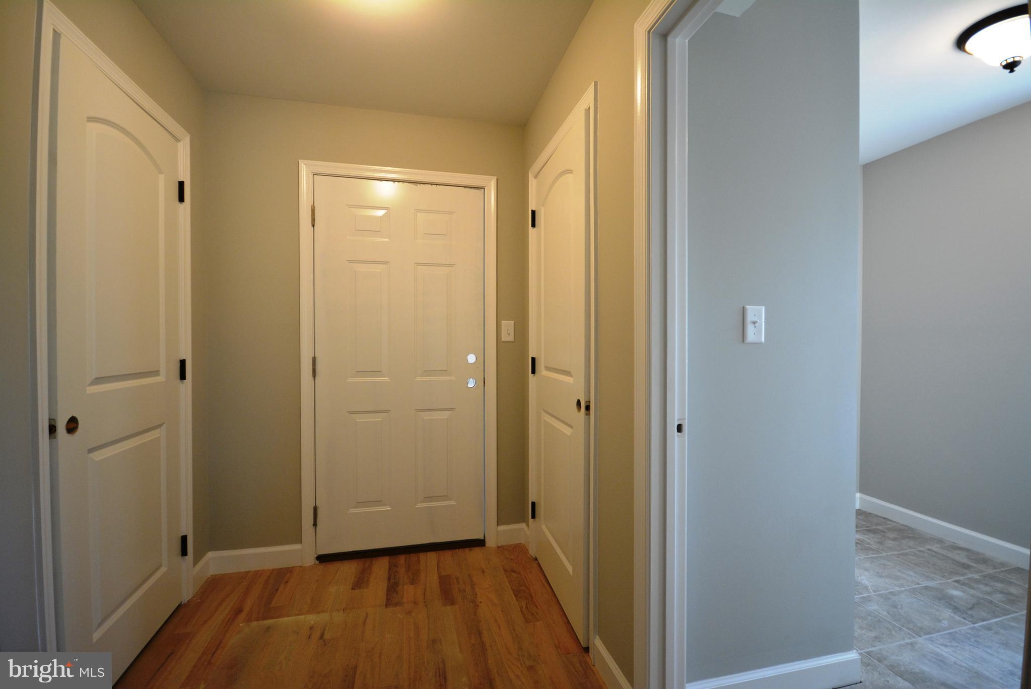 155 Lower View Road Strasburg, VA 22657 - Photo 17 of 30 a view of a hallway with wooden floor
